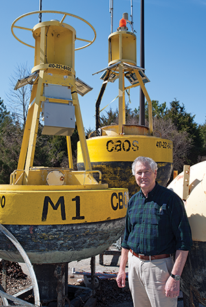 Bill Boicourt standing next to one of his CBOS buoys. Photograph, Daniel Pendick